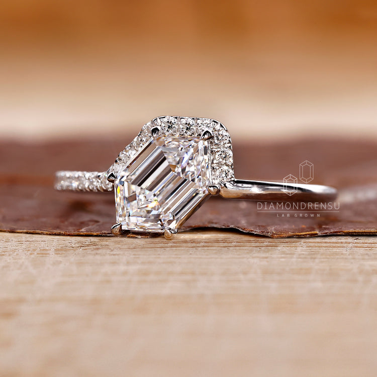 Custom hexagon diamond ring with half pave detailing in white gold.
