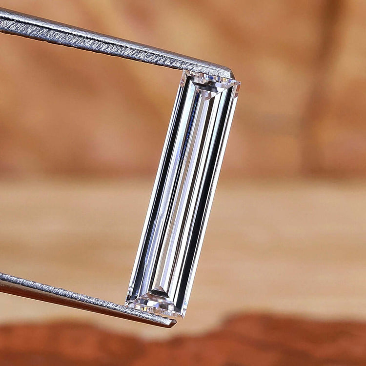 Long baguette cut diamond with 0.76 carat weight.
