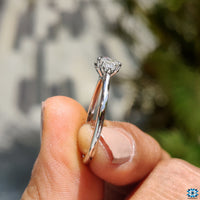 Custom Diamondrensu engagement ring featuring round moissanite stones.