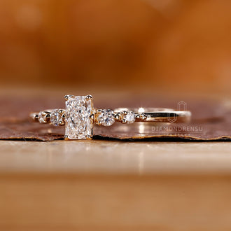 Custom Engagement Ring featuring radiant cut diamonds and round cut side stones.
