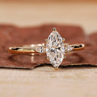 Three Stone Ring with brilliant marquise diamonds for added sparkle.