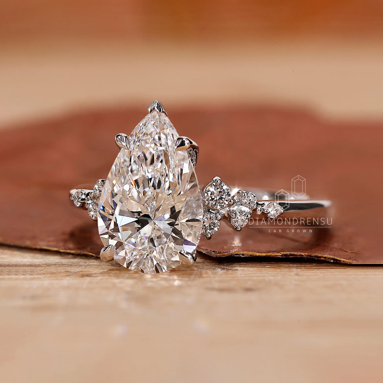 A teardrop ring​ featuring a handcrafted design that enhances its unique shape.
