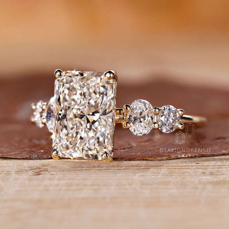 Oval ring featuring radiant cut diamonds for a classic and timeless look.
