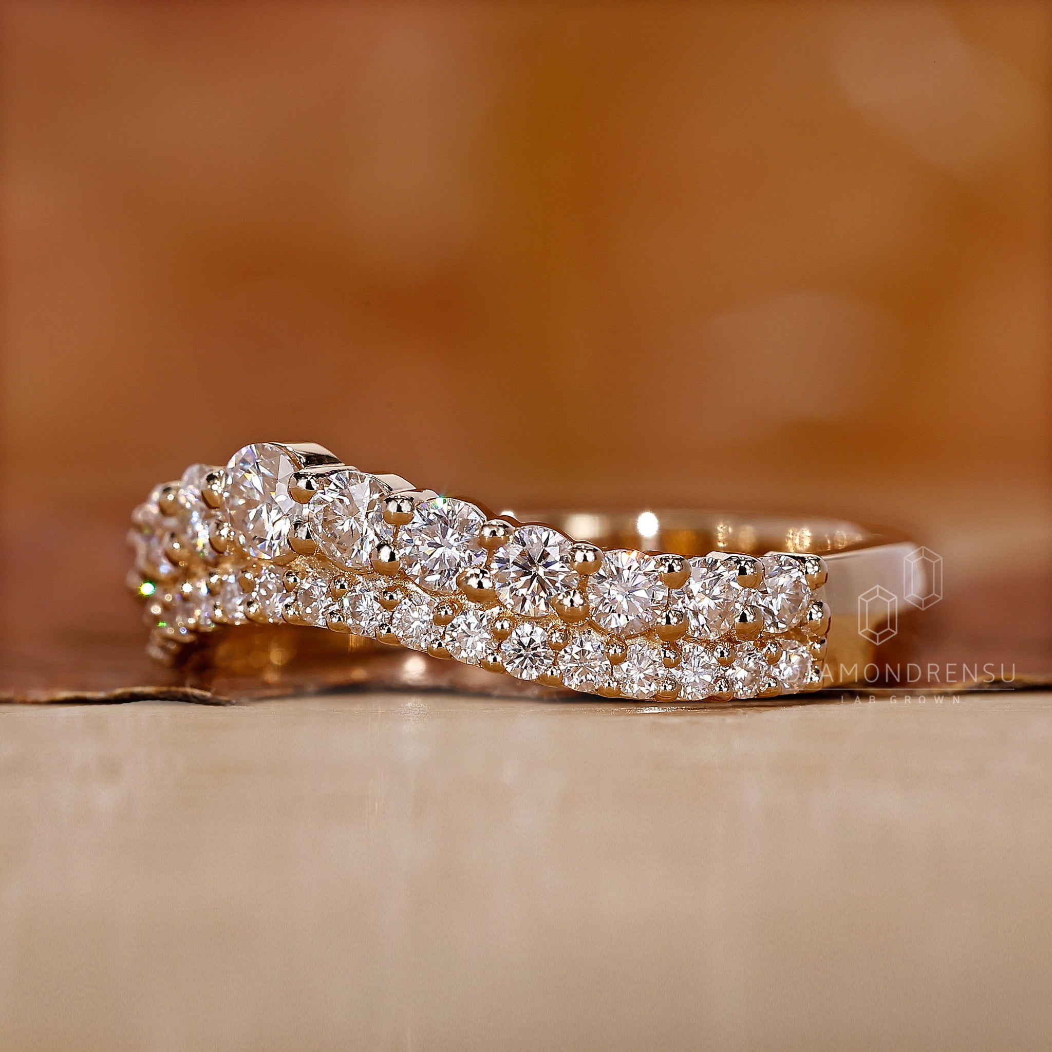 Double Row Curved Band with sparkling diamond accents.