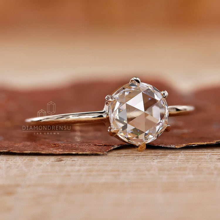 Claw Prongs holding the round diamond securely in place.