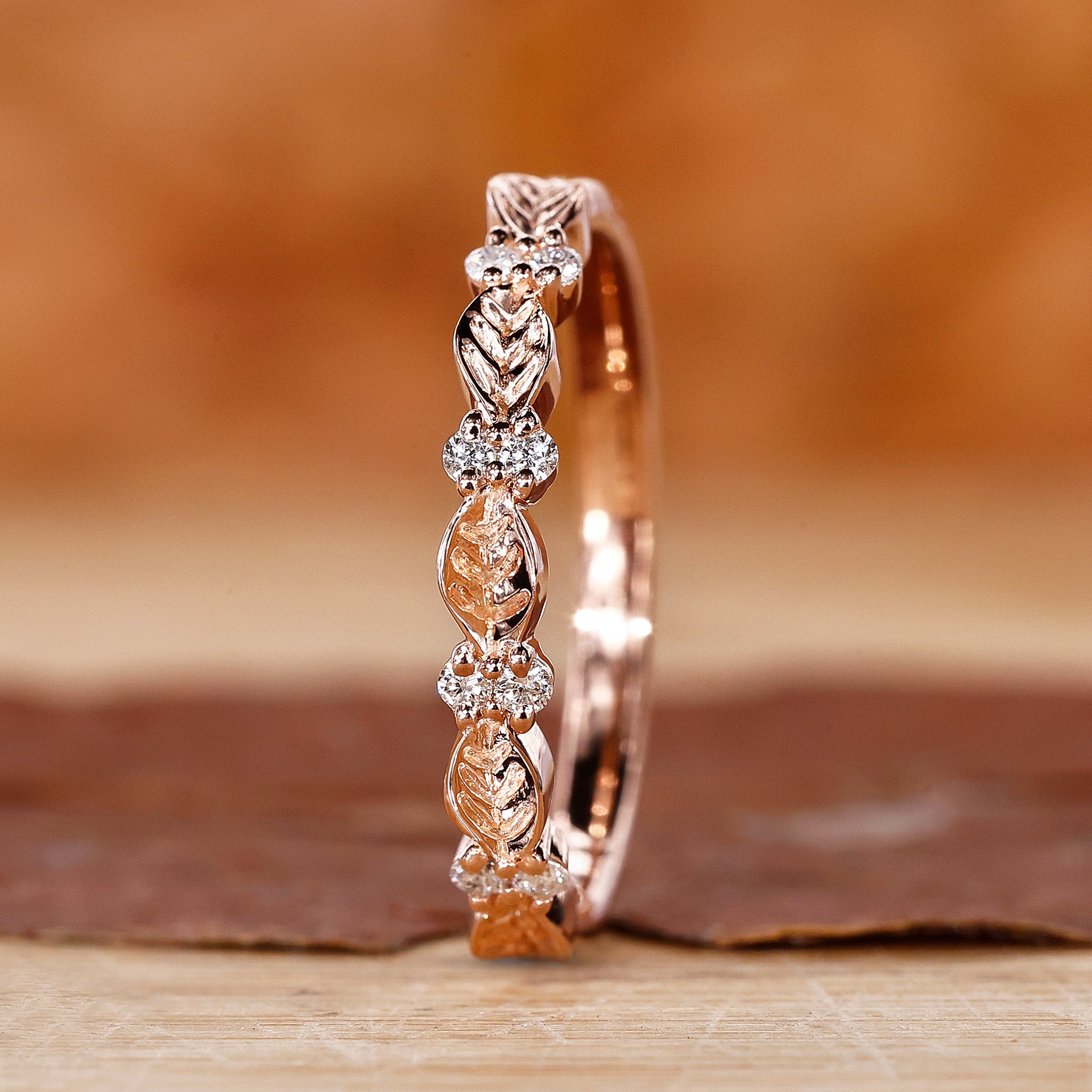 Elegant leaf wedding band with round cut diamond, a perfect nature inspired wedding band