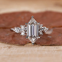 White gold engagement ring with marquise side stones.