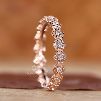 Elegant rose gold wedding band with a modern touch.
