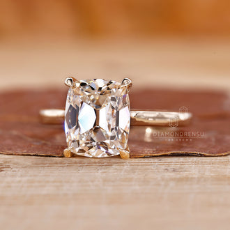 Cathedral ring with old mine cushion cut diamond.