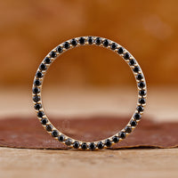 Minimalist wedding band with delicate diamond accents.
