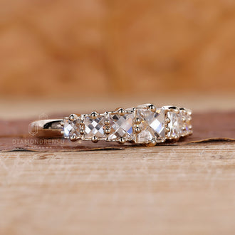 Handmade band with French cut diamonds in a yellow gold setting.
