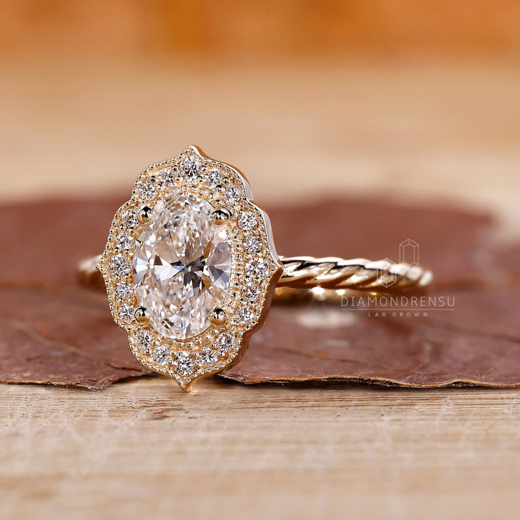 Round diamond halo ring in a delicate setting.
