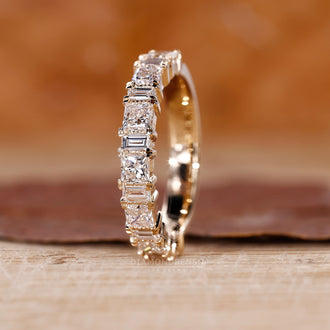 Custom yellow gold wedding band with a half eternity design.
