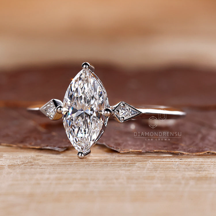 Custom engagement ring with knife edge shank and compass prongs.
