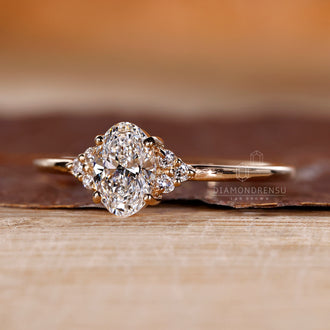 Four prong setting ring holding oval diamond securely in yellow gold.
