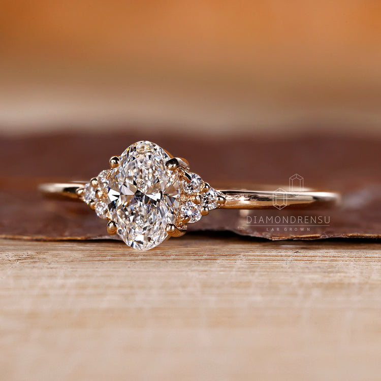 Four prong setting ring holding oval diamond securely in yellow gold.
