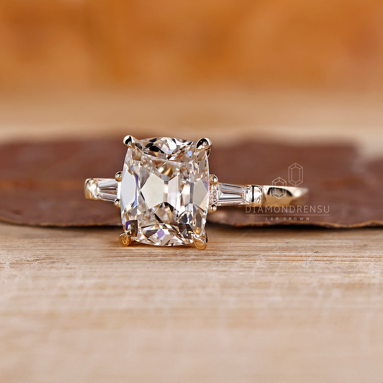 Basket setting engagement ring featuring a cushion cut diamond, providing both security and style.

