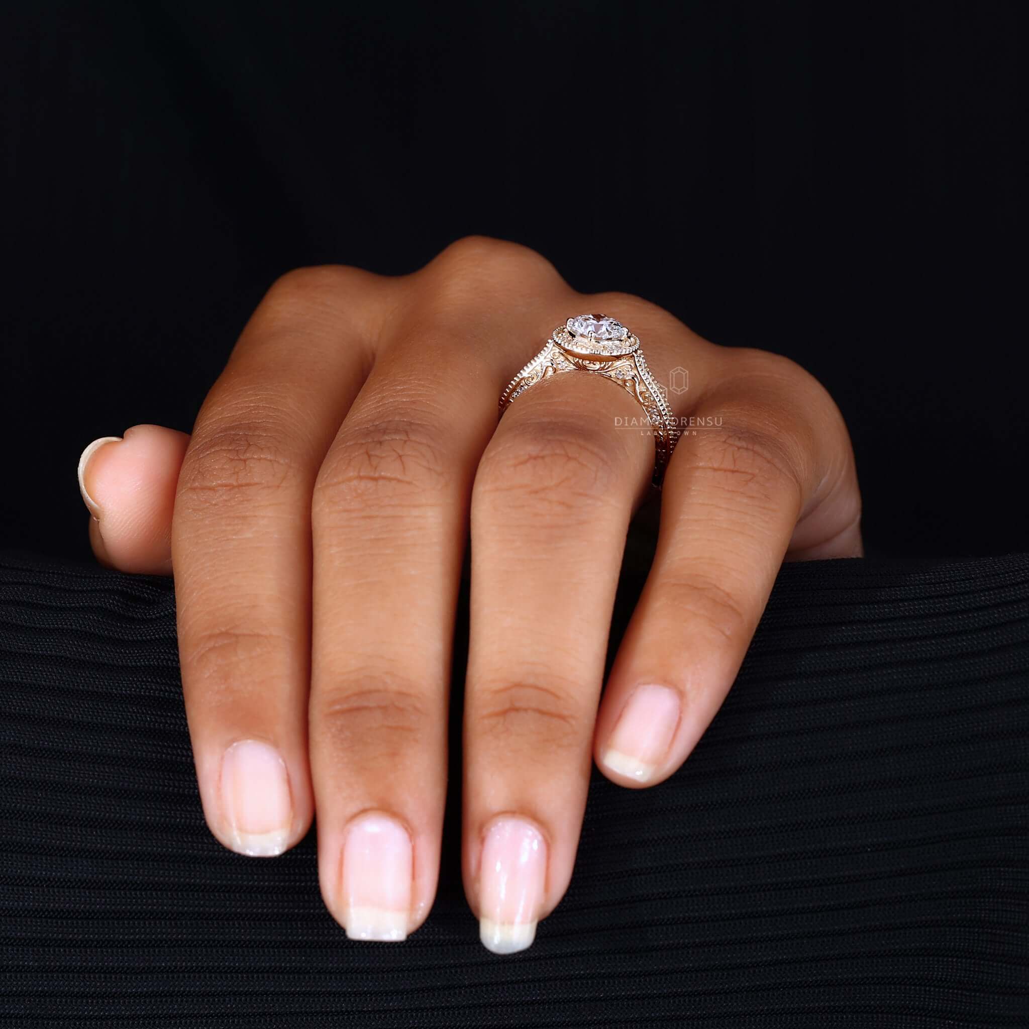 Woman's hand adorned with a vintage art deco ring, exemplifying the elegance of past eras