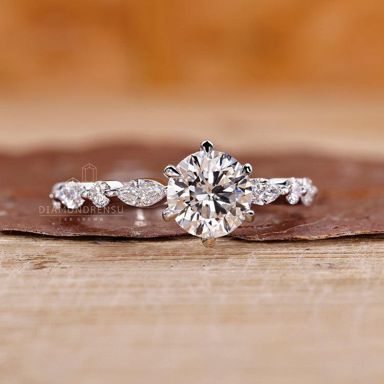 Marquise and round diamond blend beautifully in this ring.
