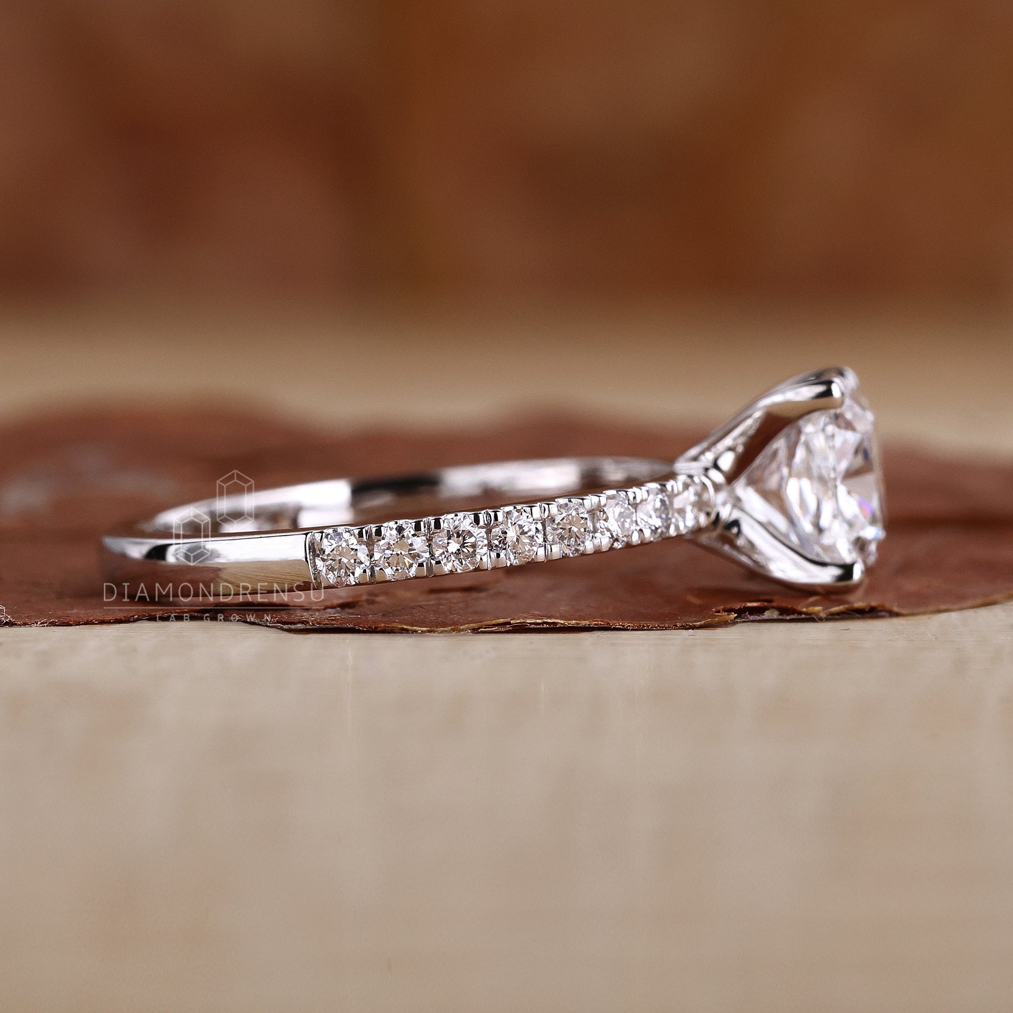 Stunning cushion cut diamond engagement ring with round prong setting.