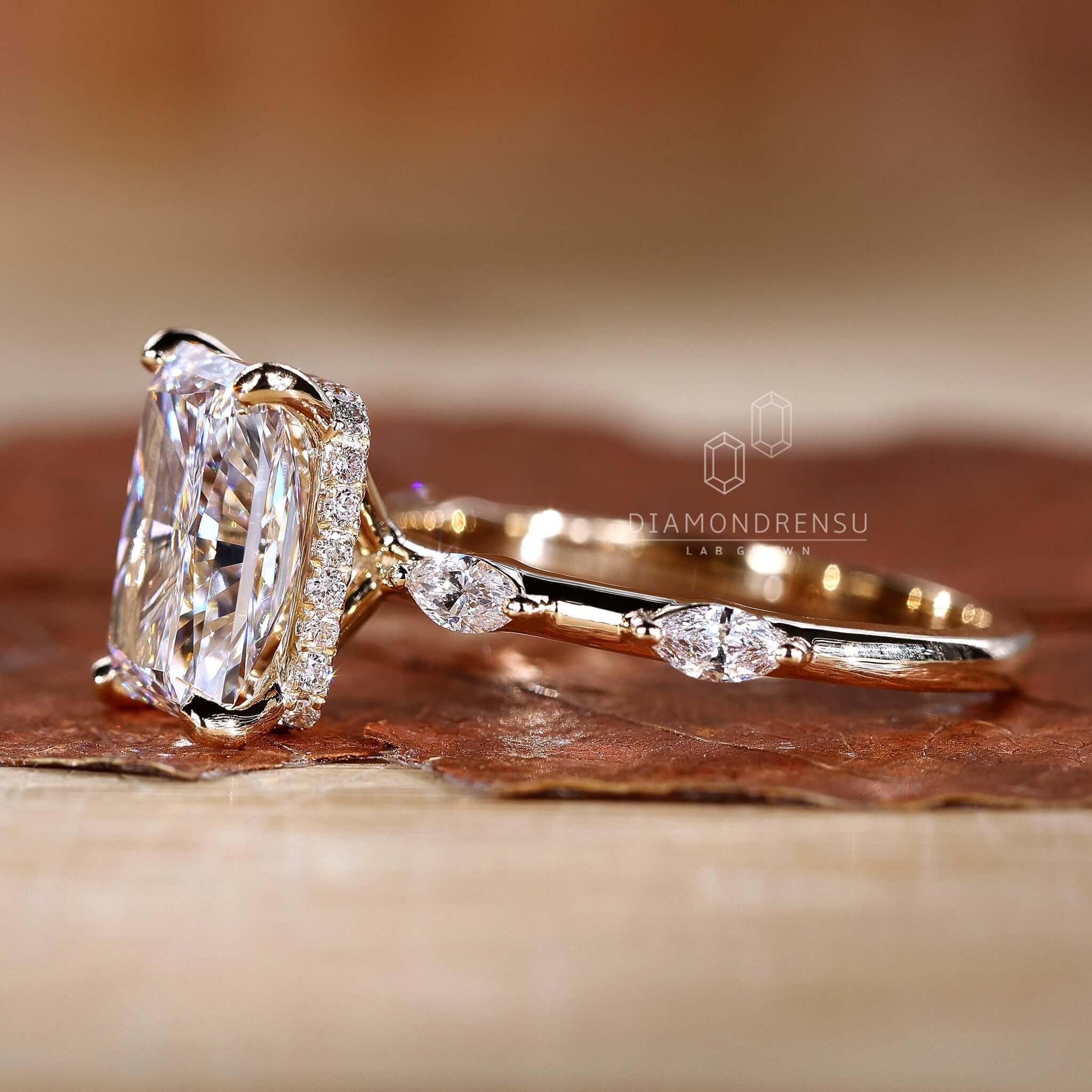 Hand wearing a radiant cut ring, highlighting its unique shape and sparkling beauty