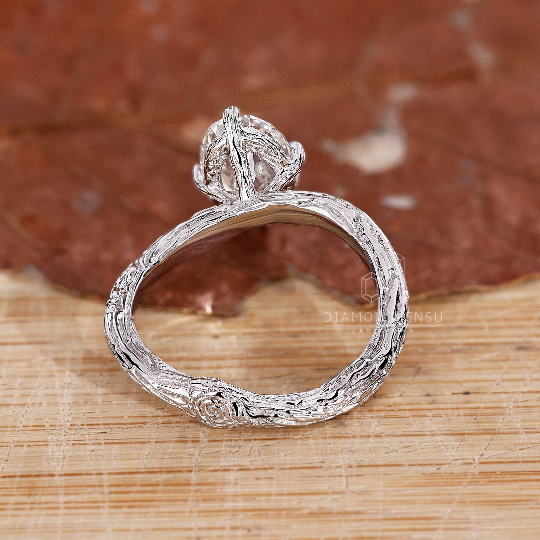 Elegant oval solitaire ring with a nature-inspired band. The diamond is IGI certified and handmade by Diamondrensu, perfect for a unique engagement.