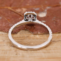 White gold jewellery ring with an emerald cut engagement ring for a modern feel.
