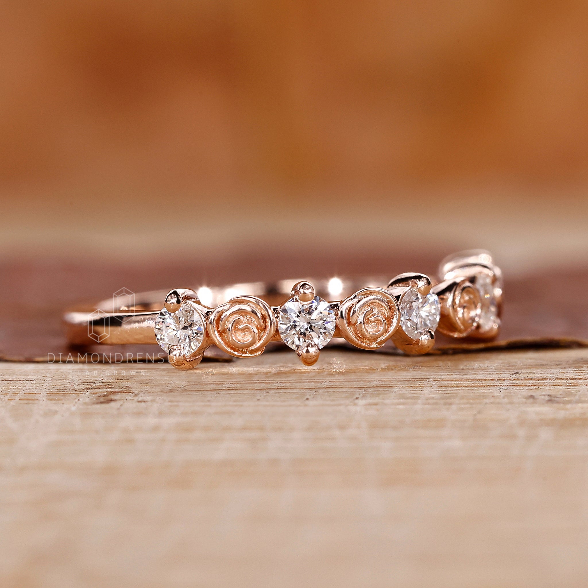 Collection of nature-inspired diamond wedding bands featuring round diamonds and floral patterns