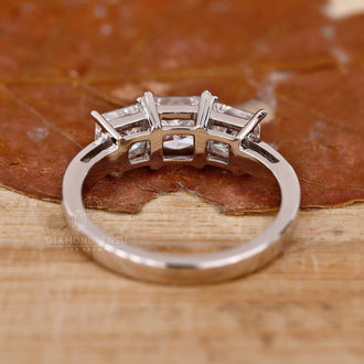 Lab grown diamond ring with a modern three-stone design.
