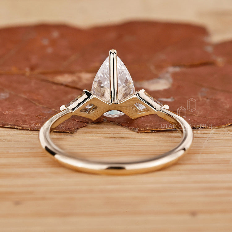 Yellow Gold Engagement Ring featuring three stunning diamonds.