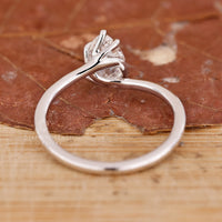 Solitaire Ring with a captivating pear-shaped diamond centerpiece.
