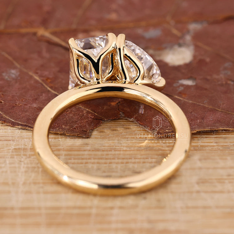 Handmade jewelry piece with yellow gold two stone design.
