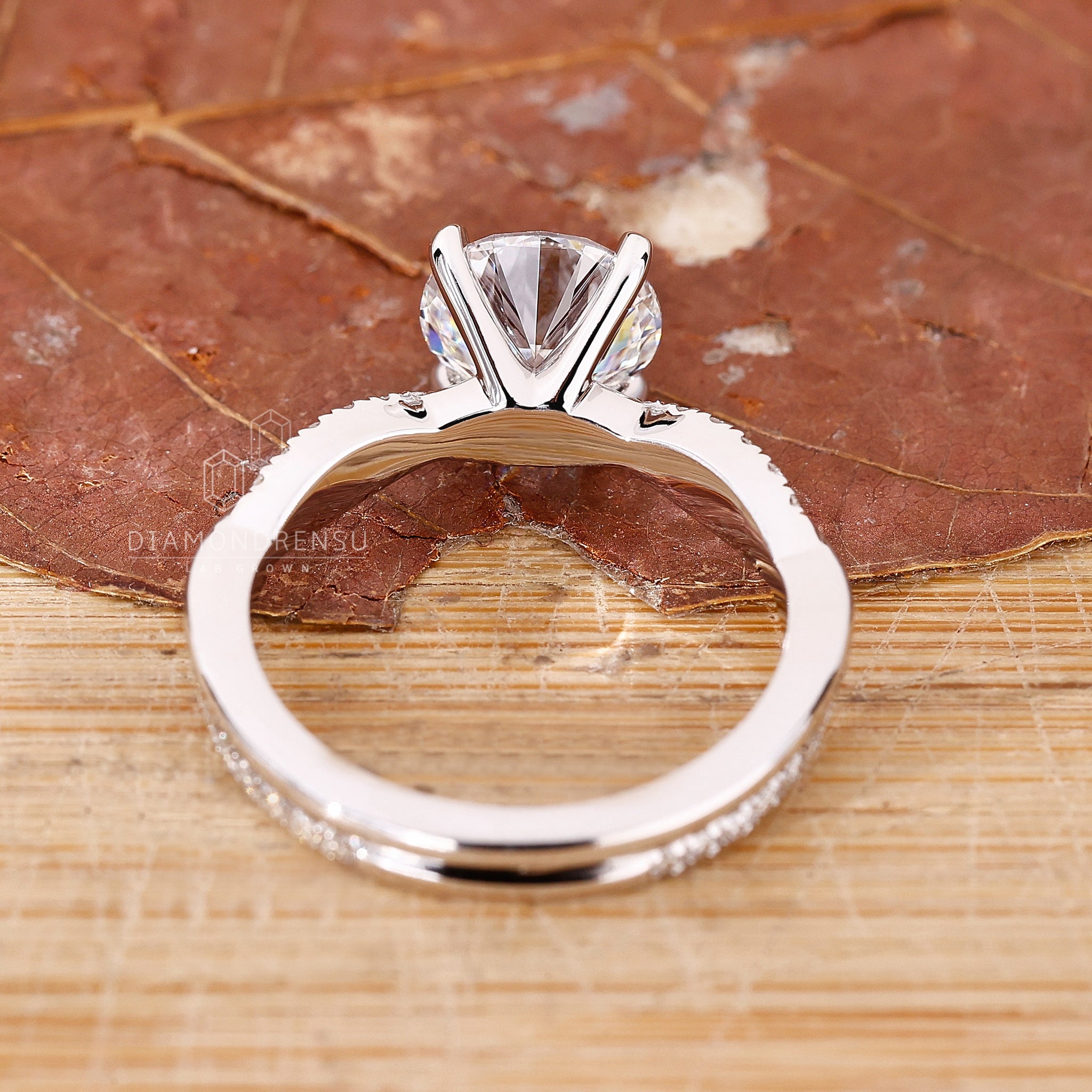 Unique custom engagement ring photographed with floral background.
