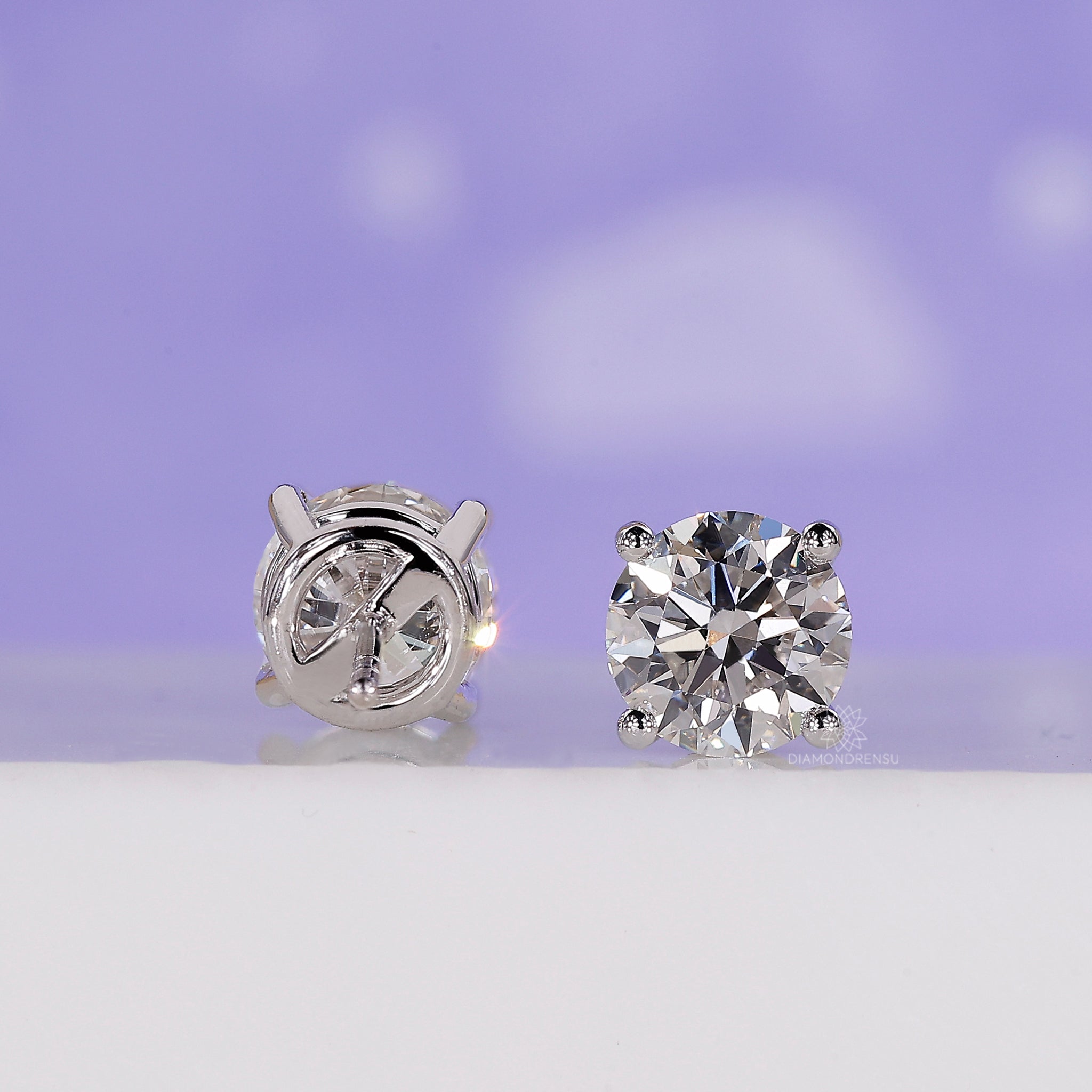 Round diamond earrings in push back earrings style for effortless elegance.
