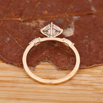Custom engagement ring featuring marquise accents.

