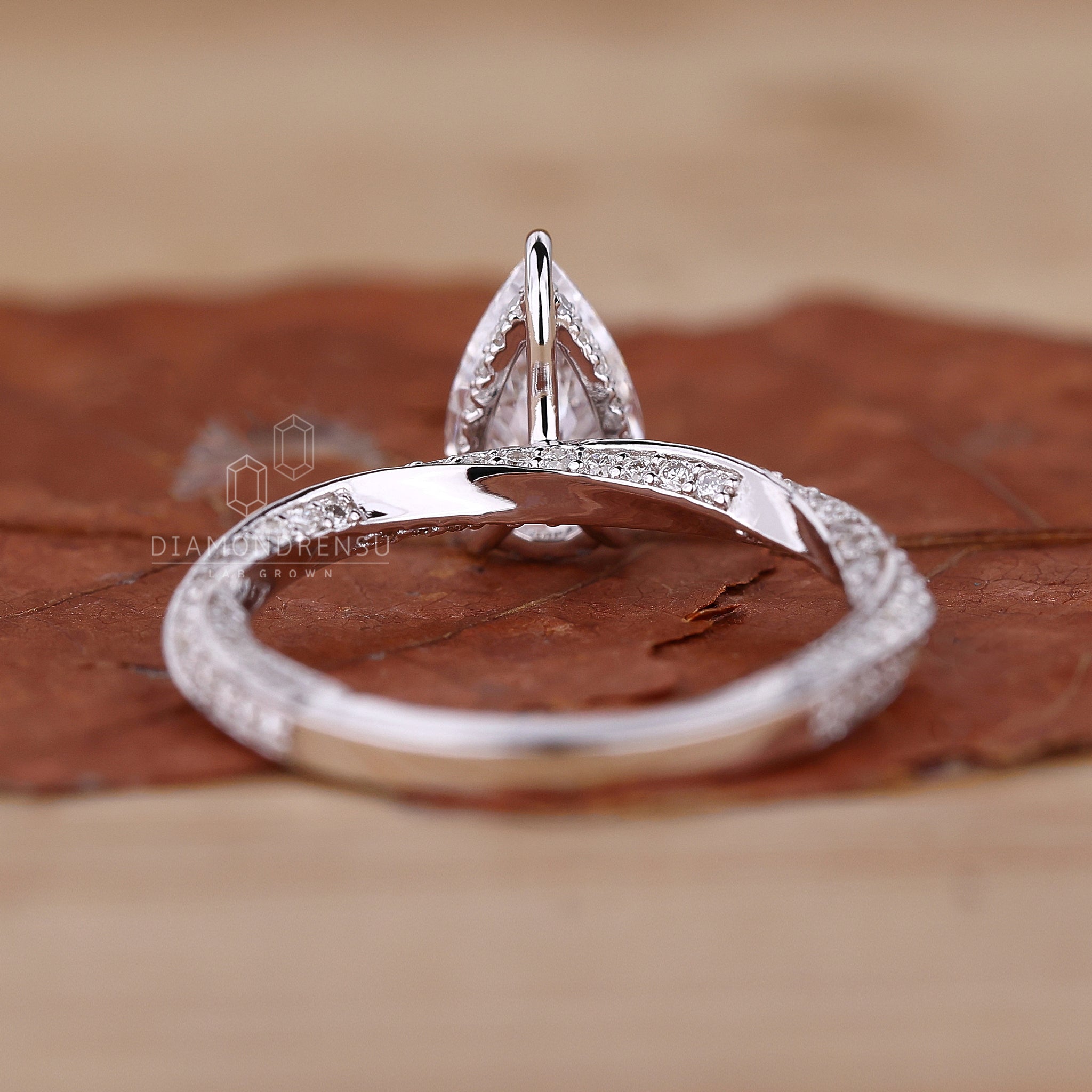 Lab grown pear diamond ring with a hidden halo setting