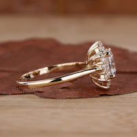 Cushion cut halo diamond ring in a prong setting.
