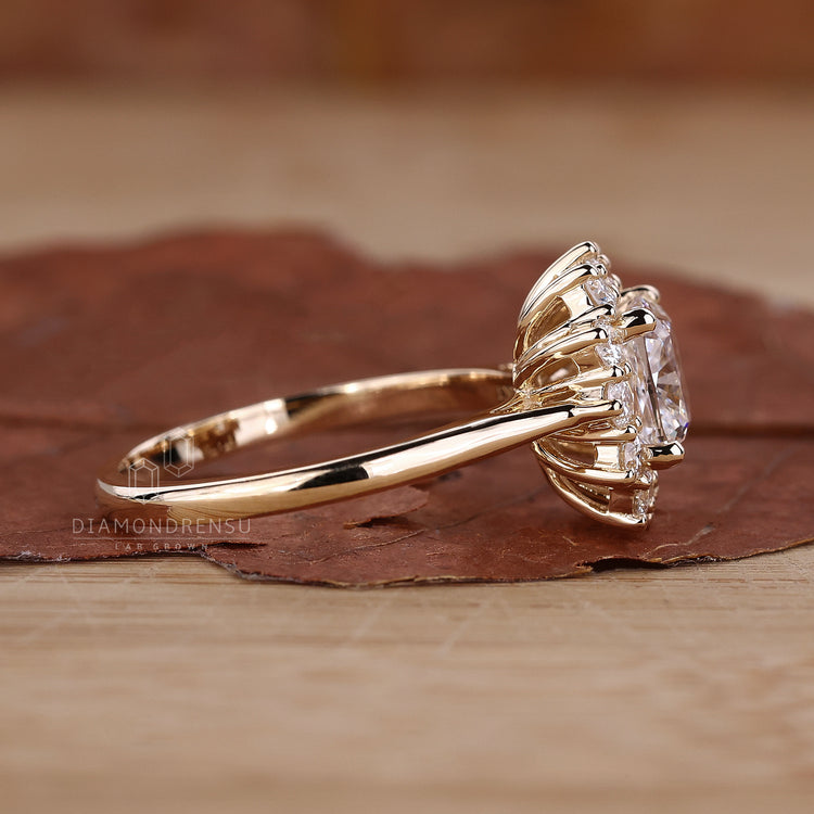 Cushion cut halo diamond ring in a prong setting.
