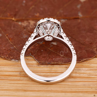 Halo engagement ring with pave setting ring.
