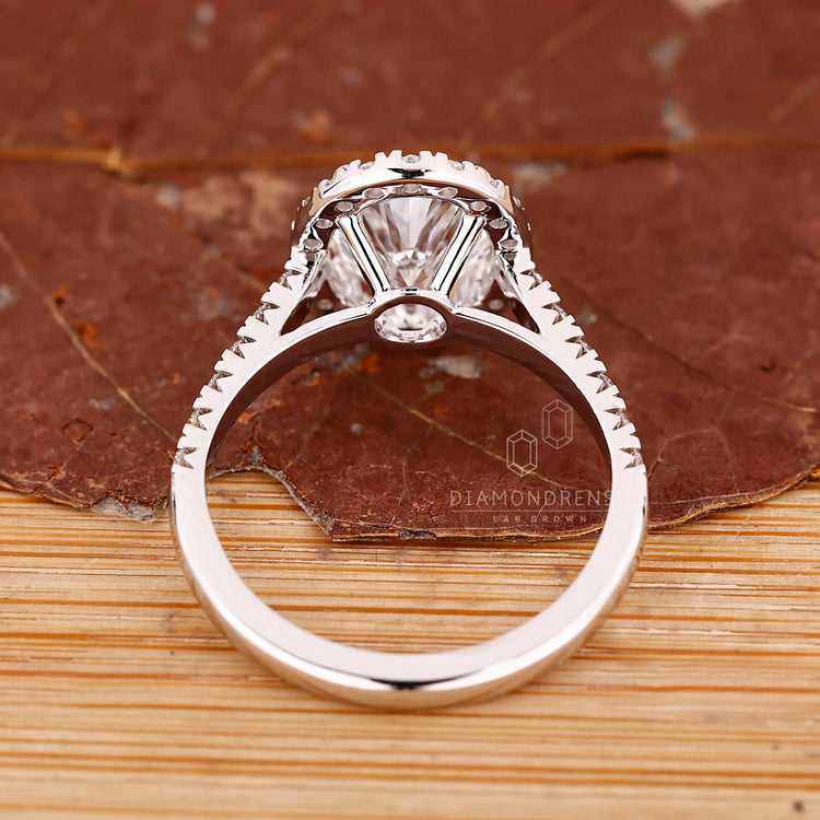 Halo engagement ring with pave setting ring.
