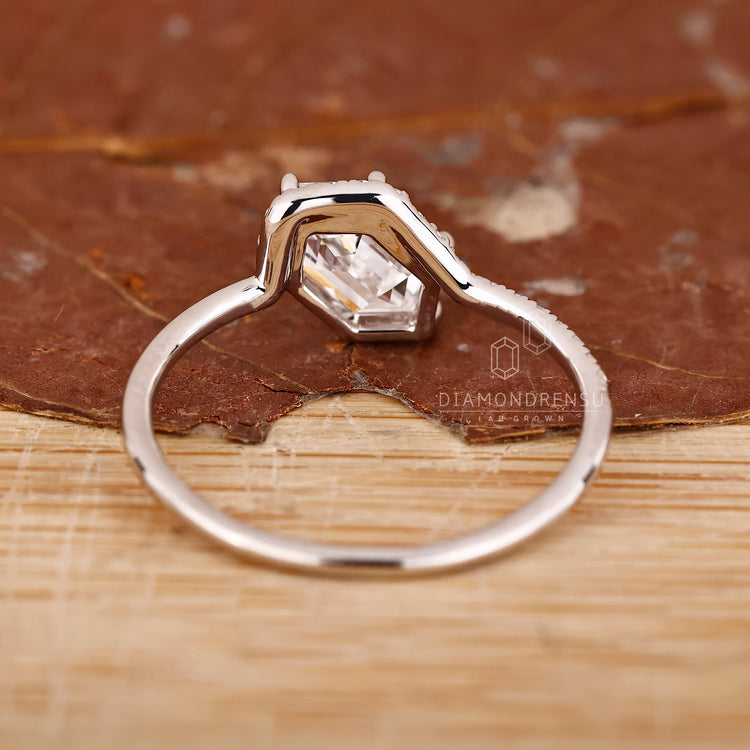 Low setting hexagon diamond ring with handcrafted details.