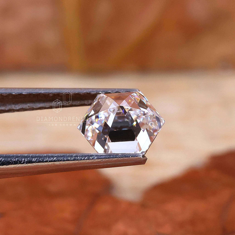 Loose antique cut diamond with a sharp hexagon step cut, weighing 1 carat.
