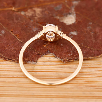 Buy engagement ring with oval diamond and seven stone arrangement.
