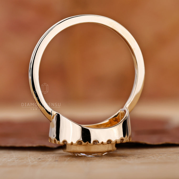 Half halo engagement ring with round cut side stone.
