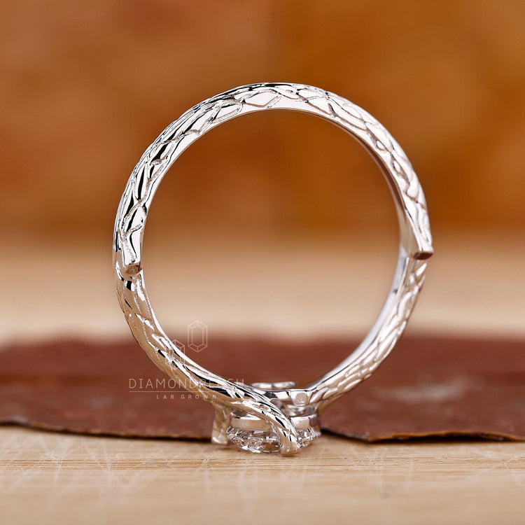 Handmade diamondrensu ring showcasing a round solitaire diamond set in a nature-inspired white gold band with intricate branch motifs