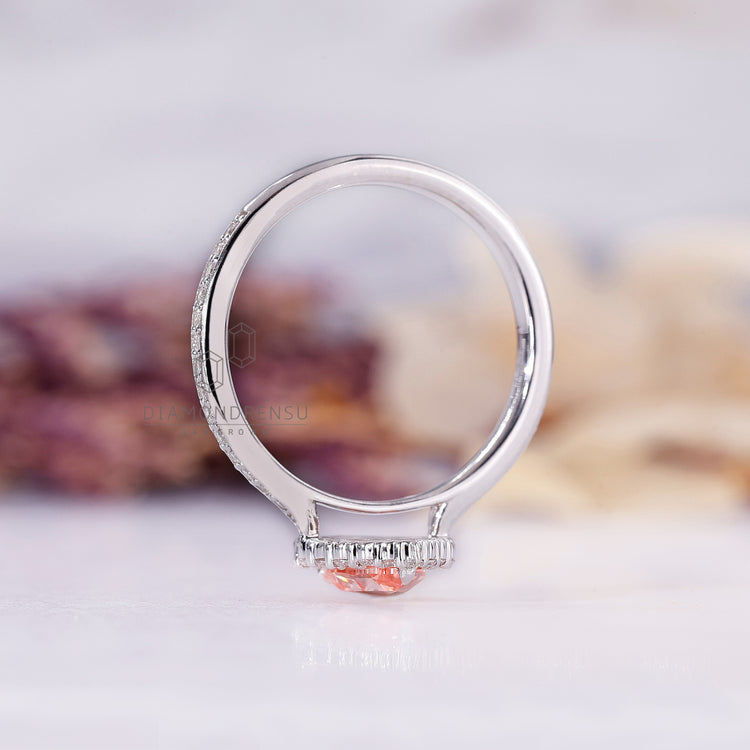 Custom pear halo diamond engagement ring.