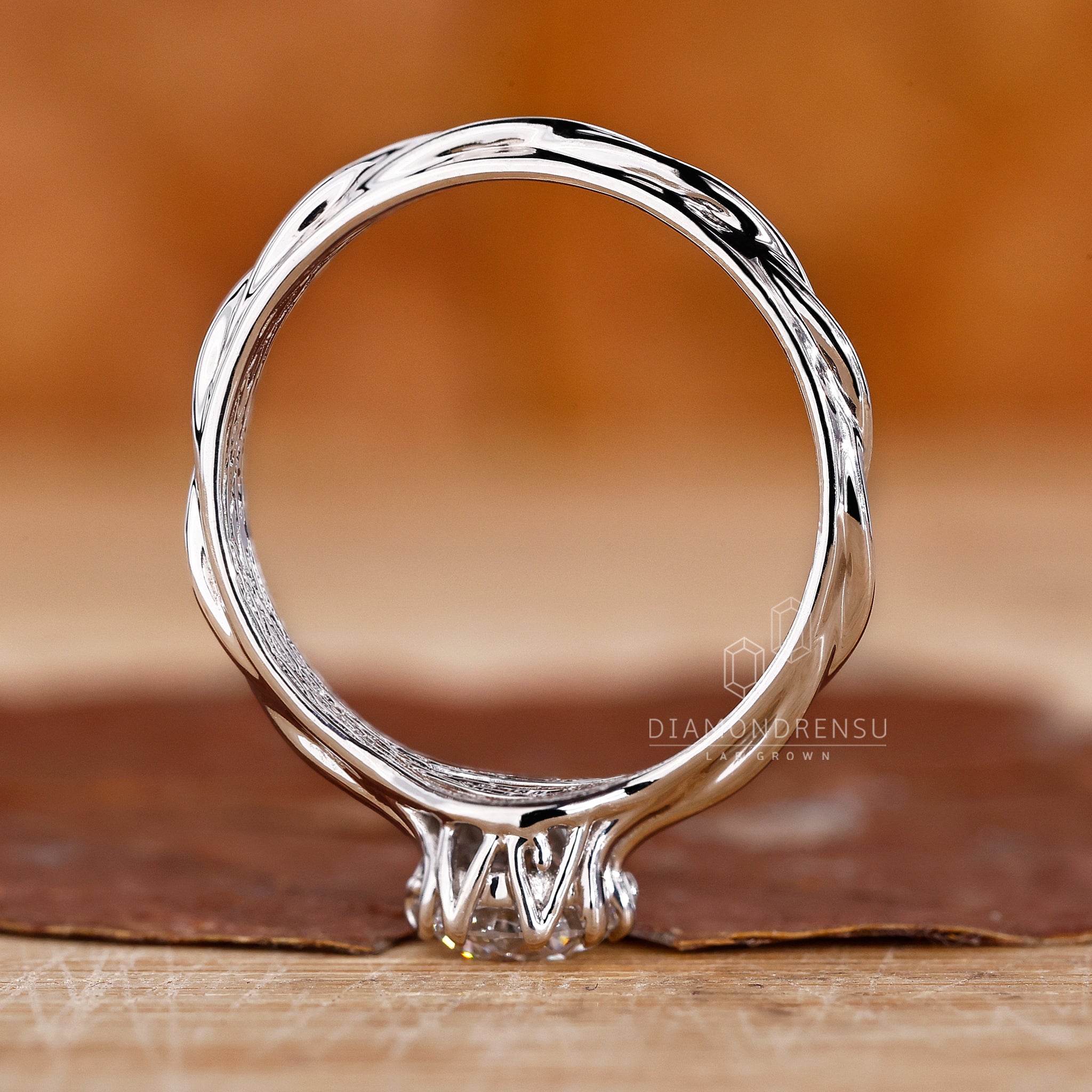 Classic round solitaire engagement ring featuring a branch-inspired band, ideal for nature lovers