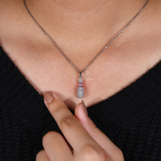 Diamondrensu pendant with Bowling Pin charm and prong set design.
