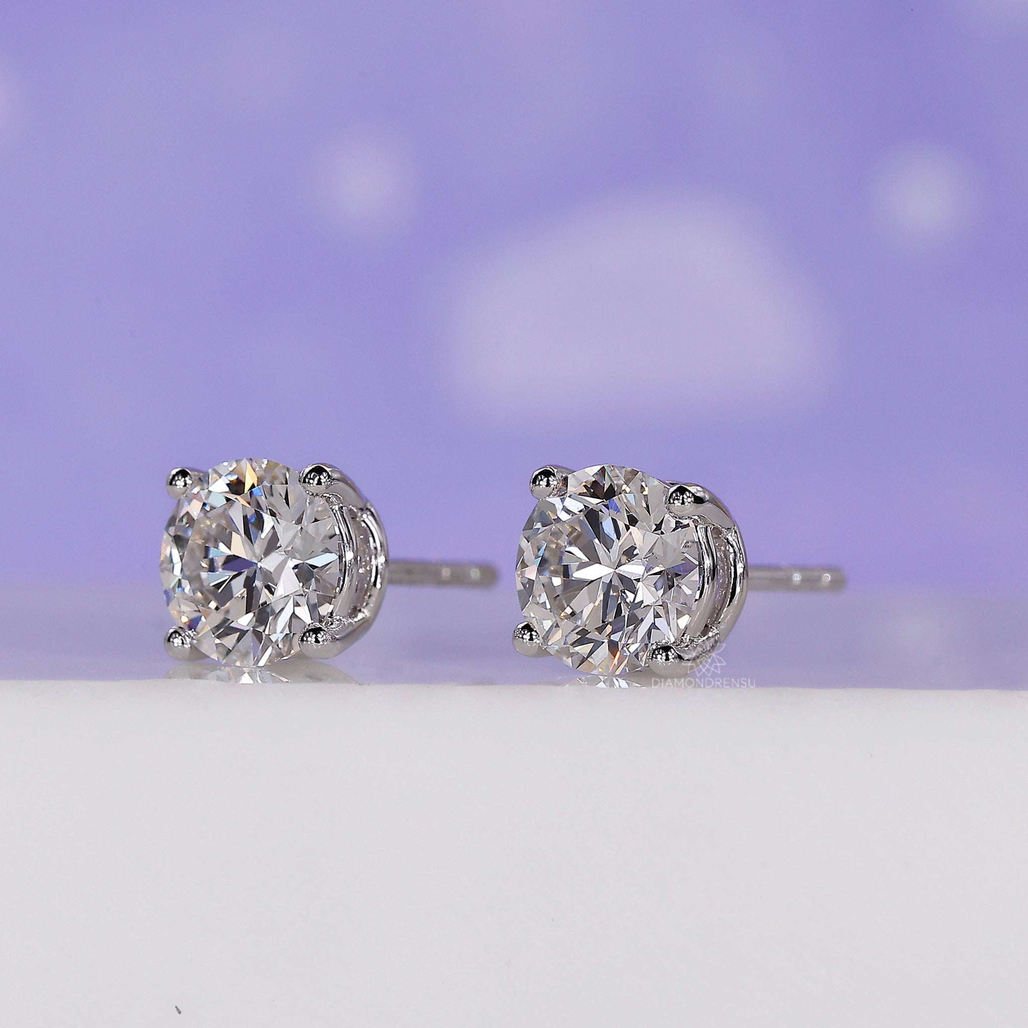 Round diamond with 4 prong diamond stud earrings for brilliance and durability.
