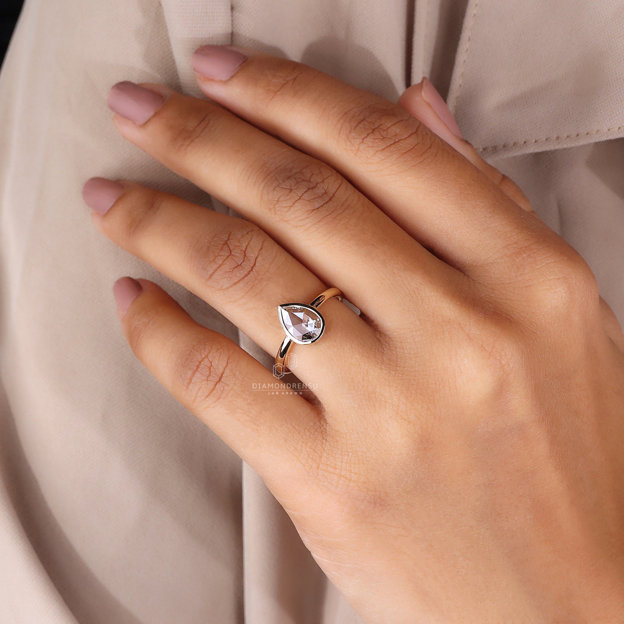 Minimalist bezel engagement ring for modern brides.
